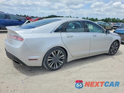 Trzecie zdjęcie samochodu z tyłu: 2017 LINCOLN MKZ SELECT VIN:3LN6L5C90HR604924 - miniatura