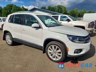 Czwarte zdjęcie samochodu z boku: 2013 VOLKSWAGEN TIGUAN S VIN:WVGBV3AX9DW619444 - miniatura