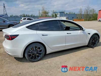 Trzecie zdjęcie samochodu z tyłu: 2023 TESLA MODEL 3 VIN:LRW3E1EB2PC851642 - miniatura