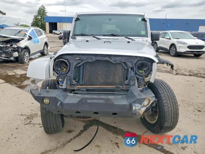 Piąte zdjęcie samochodu w środku: 2009 JEEP WRANGLER UNLIMITED SAHARA VIN:1J4GA59119L751666 - miniatura
