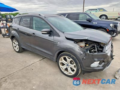 Czwarte zdjęcie samochodu z boku: 2019 FORD ESCAPE TITANIUM VIN:1FMCU9J90KUB59143 - miniatura