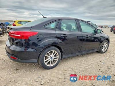 Trzecie zdjęcie samochodu z tyłu: 2016 FORD FOCUS SE VIN:1FADP3F2XGL286459 - miniatura