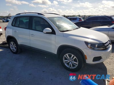 Czwarte zdjęcie samochodu z boku: 2016 VOLKSWAGEN TIGUAN S VIN:WVGAV7AX0GW585613 - miniatura