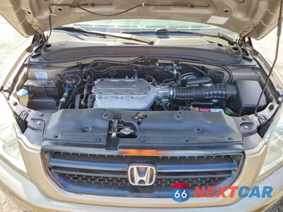 Zdjęcie 11 z 12 samochodu: 2005 HONDA PILOT EXL VIN:2HKYF18705H529046 - miniatura