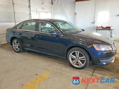 Czwarte zdjęcie samochodu z boku: 2014 VOLKSWAGEN PASSAT SE VIN:1VWBN7A39EC044528 - miniatura