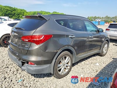 Trzecie zdjęcie samochodu z tyłu: 2013 HYUNDAI SANTA FE SPORT 2.0T VIN:5XYZUDLA3DG046686 - miniatura