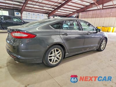 Trzecie zdjęcie samochodu z tyłu: 2016 FORD FUSION SE VIN:1FA6P0H76G5118600 - miniatura