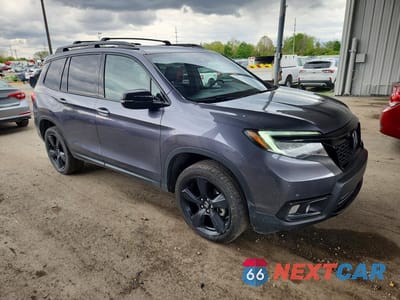 Czwarte zdjęcie samochodu z boku: 2020 HONDA PASSPORT ELITE VIN:5FNYF8H0XLB016264 - miniatura