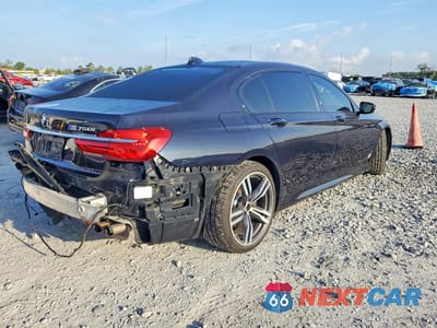 Trzecie zdjęcie samochodu z tyłu: 2016 BMW 750 I VIN:WBA7F0C55GGM20713 - miniatura
