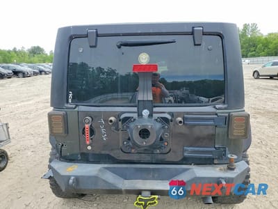 Zdjęcie 6 z 13 samochodu: 2011 JEEP WRANGLER UNLIMITED SAHARA VIN:1J4BA5H15BL532579 - miniatura