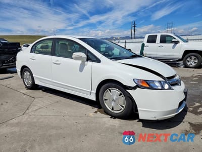Czwarte zdjęcie samochodu z boku: 2007 HONDA CIVIC HYBRID VIN:JHMFA36207S025673 - miniatura
