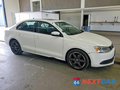 Czwarte zdjęcie samochodu z boku: 2011 VOLKSWAGEN JETTA TDI VIN:3VW3L7AJ9BM124253 - miniatura
