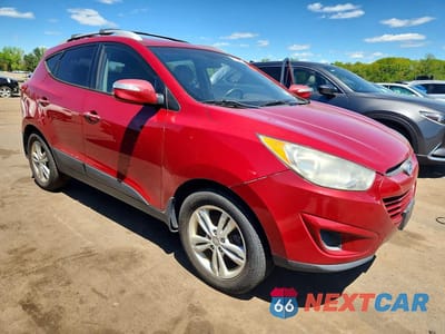 Czwarte zdjęcie samochodu z boku: 2012 HYUNDAI TUCSON GLS VIN:KM8JUCAC4CU534775 - miniatura