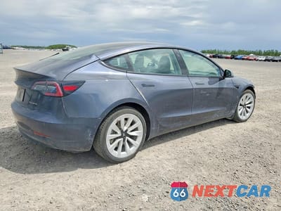 Trzecie zdjęcie samochodu z tyłu: 2022 TESLA MODEL 3 VIN:5YJ3E1EB5NF349016 - miniatura