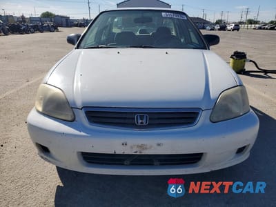 Piąte zdjęcie samochodu w środku: 1999 HONDA CIVIC LX VIN:2HGEJ6670XH592467 - miniatura