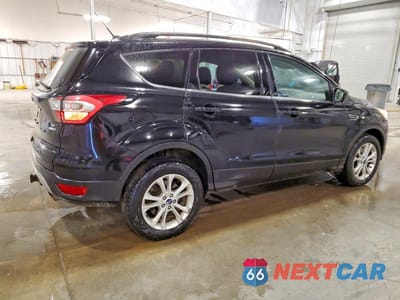 Trzecie zdjęcie samochodu z tyłu: 2017 FORD ESCAPE SE VIN:1FMCU9G9XHUC26105 - miniatura