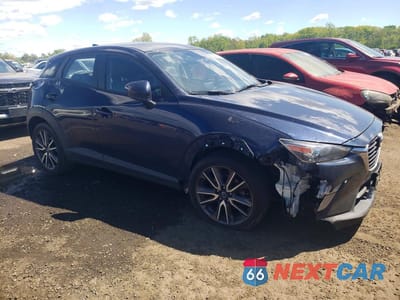 Czwarte zdjęcie samochodu z boku: 2017 MAZDA CX-3 TOURING VIN:JM1DKFC70H0172936 - miniatura