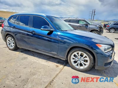 Czwarte zdjęcie samochodu z boku: 2014 BMW X1 XDRIVE28I VIN:WBAVL1C52EVY11526 - miniatura