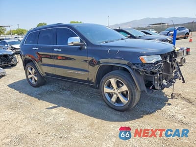 Czwarte zdjęcie samochodu z boku: 2014 JEEP GRAND CHEROKEE OVERLAND VIN:1C4RJECG3EC164519 - miniatura