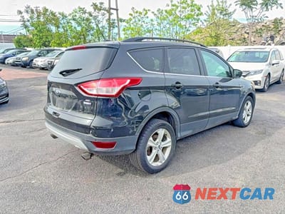 Czwarte zdjęcie samochodu z boku: 2014 FORD ESCAPE SE VIN:1FMCU9G98EUC77338 - miniatura