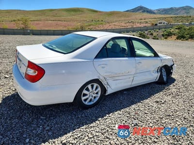 Trzecie zdjęcie samochodu z tyłu: 2002 TOYOTA CAMRY XLE V6 VIN:JTDBF30K420002122 - miniatura