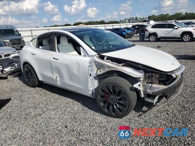 Czwarte zdjęcie samochodu z boku: 2022 TESLA MODEL Y VIN:7SAYGDEF0NF517779 - miniatura