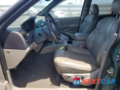Zdjęcie 7 z 13 samochodu: 1999 JEEP GRAND CHEROKEE LAREDO VIN:1J4GW58S6XC569065 - miniatura