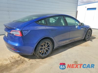 Trzecie zdjęcie samochodu z tyłu: 2022 TESLA MODEL 3 VIN:5YJ3E1EA7NF290865 - miniatura