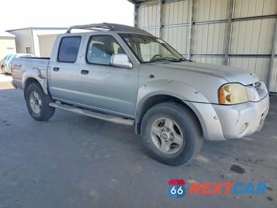 Czwarte zdjęcie samochodu z boku: 2001 NISSAN FRONTIER XE VIN:1N6ED27Y61C382887 - miniatura