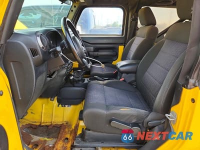 Zdjęcie 7 z 12 samochodu: 2011 JEEP WRANGLER VIN:1J4GA2D11BL533223 - miniatura