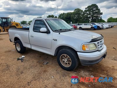 Czwarte zdjęcie samochodu z boku: 2002 FORD F150 VIN:1FTRF17202NB33138 - miniatura