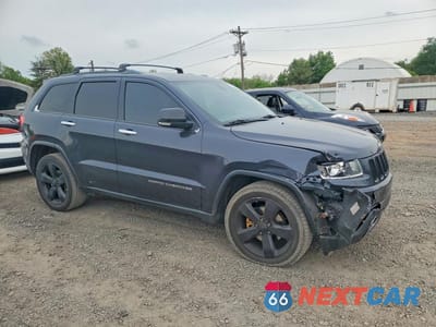 Czwarte zdjęcie samochodu z boku: 2014 JEEP GRAND CHEROKEE LIMITED VIN:1C4RJFBG7EC122281 - miniatura