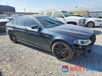 Czwarte zdjęcie samochodu z boku: 2016 BMW M5 VIN:WBSFV9C53GG343211 - miniatura