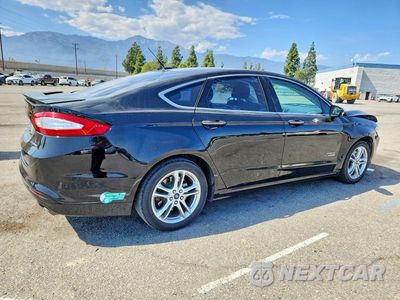 Trzecie zdjęcie samochodu z tyłu: 2016 FORD FUSION TITANIUM PHEV VIN:3FA6P0SU1GR229566 - miniatura
