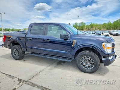 Czwarte zdjęcie samochodu z boku: 2022 FORD F150 SUPERCREW VIN:1FTEW1E89NFB98946 - miniatura