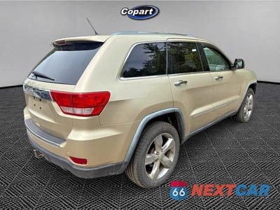 Czwarte zdjęcie samochodu z boku: 2011 JEEP GRAND CHEROKEE OVERLAND VIN:1J4RR6GT8BC605637 - miniatura