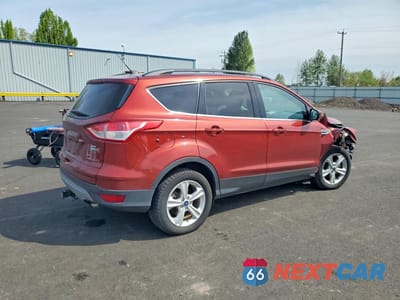 Trzecie zdjęcie samochodu z tyłu: 2016 FORD ESCAPE SE VIN:1FMCU9G99GUC00447 - miniatura