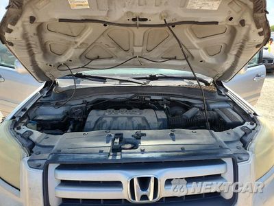 Zdjęcie 12 z 14 samochodu: 2006 HONDA PILOT EX VIN:2HKYF18726H528580 - miniatura