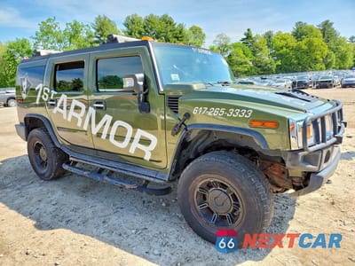 Czwarte zdjęcie samochodu z boku: 2003 HUMMER H2 VIN:5GRGN23U83H145186 - miniatura