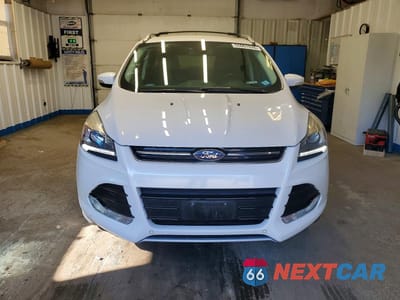 Piąte zdjęcie samochodu w środku: 2016 FORD ESCAPE TITANIUM VIN:1FMCU9JX0GUB85277 - miniatura
