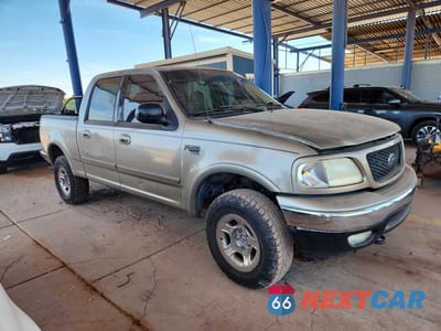 Czwarte zdjęcie samochodu z boku: 2001 FORD F-150 VIN:1FTRW08L91KA08608 - miniatura