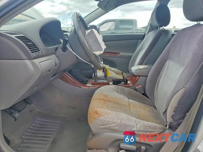 Zdjęcie 7 z 12 samochodu: 2003 TOYOTA CAMRY XLE VIN:JTDBE32K530154637 - miniatura