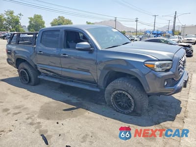 Czwarte zdjęcie samochodu z boku: 2023 TOYOTA TACOMA TRD OFF-ROAD VIN:3TMCZ5AN5PM565992 - miniatura