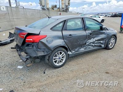 Trzecie zdjęcie samochodu z tyłu: 2018 FORD FOCUS SE VIN:1FADP3F29JL315117 - miniatura