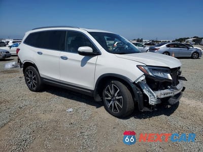 Czwarte zdjęcie samochodu z boku: 2022 HONDA PILOT TOURING VIN:5FNYF5H63NB023983 - miniatura