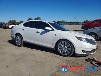 Czwarte zdjęcie samochodu z boku: 2015 LINCOLN MKS VIN:1LNHL9FTXFG606109 - miniatura