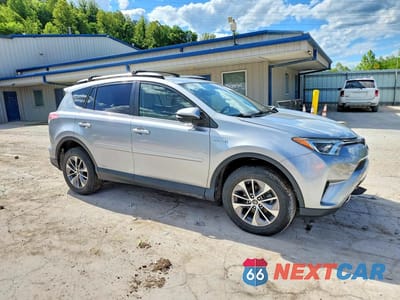 Czwarte zdjęcie samochodu z boku: 2018 TOYOTA RAV4 HYBRID LE VIN:JTMRJREV1JD259295 - miniatura