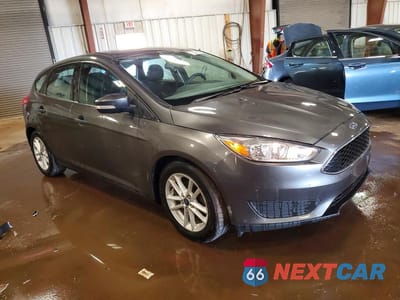 Czwarte zdjęcie samochodu z boku: 2017 FORD FOCUS SE VIN:1FADP3K23HL213960 - miniatura