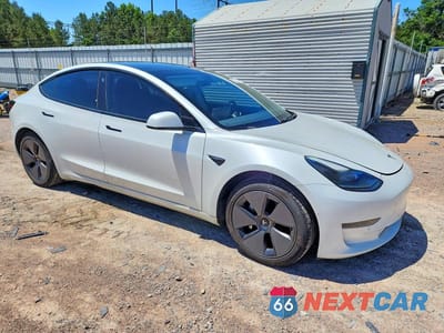 Czwarte zdjęcie samochodu z boku: 2021 TESLA MODEL 3 VIN:5YJ3E1EAXMF919968 - miniatura