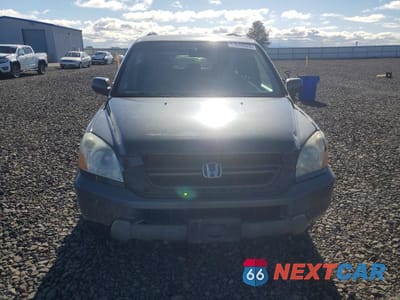 Piąte zdjęcie samochodu w środku: 2005 HONDA PILOT EX VIN:2HKYF18455H552215 - miniatura